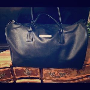 Black leather duffle by Mercedes Benz